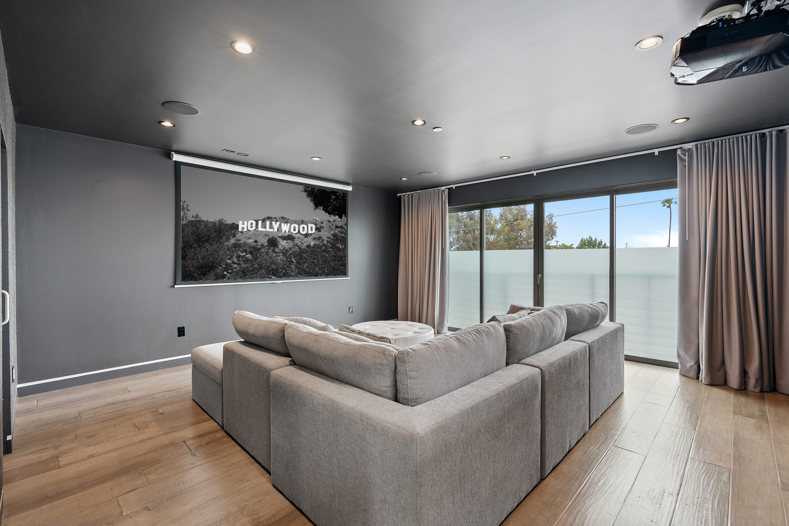 Comfort is king when melting into the cozy couches in the private home theatre.