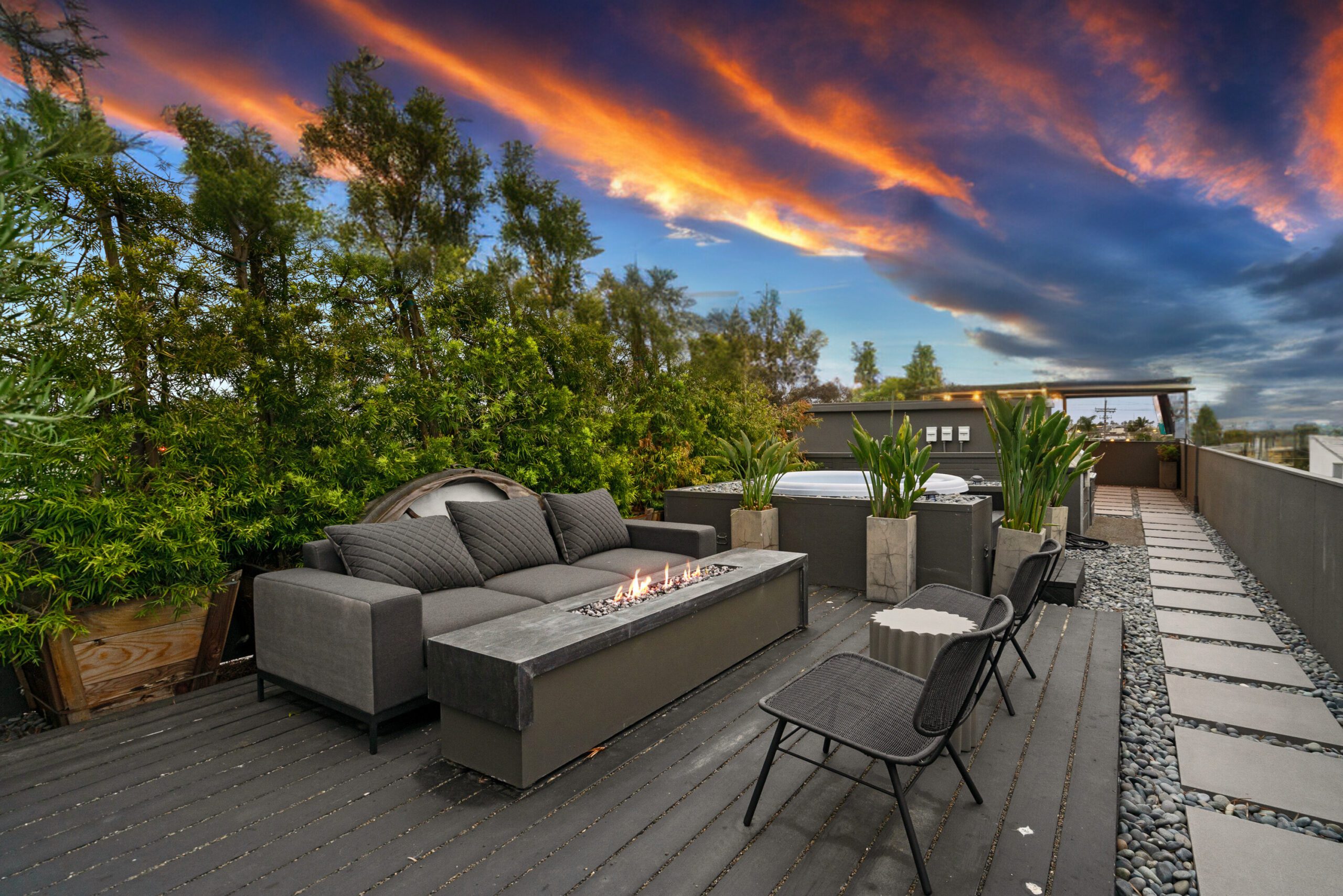 Cozy up next to the rooftop firepit under the stars.